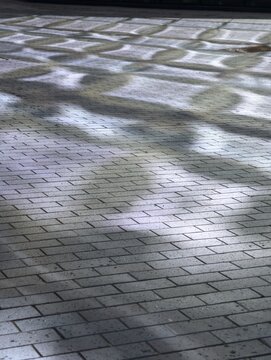 Сaustics from glass facade on pavement tiles isolated png on a transparent background premium cutout (light reflections, sunlight pattern)