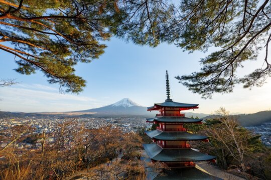 Five-story pagoda of a Shinto Shrine, Chureito Pagoda, with views of Fujiyoshida City and Mount Fuji volcano at sunset, Arakura Fuji Sengen Shrine, Arakurayama Sengen Park, Yamanashi Prefecture, Japan