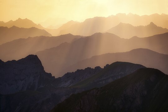 View from Brienzer Rothorn to Central Swiss Alps, cloudy atmosphere at sunrise, Canton Bern, Canton Obwaden, Switzerland