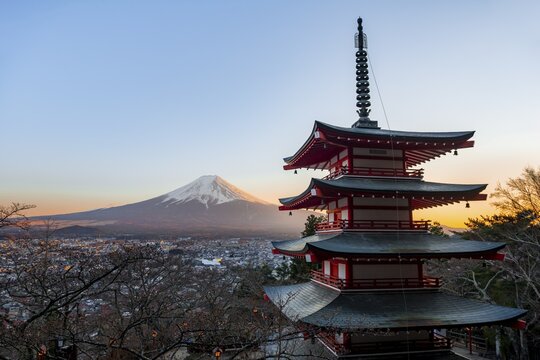 Five-story pagoda of a Shinto Shrine, Chureito Pagoda, with views of Fujiyoshida City and Mount Fuji volcano at sunset, Arakura Fuji Sengen Shrine, Arakurayama Sengen Park, Yamanashi Prefecture, Japan