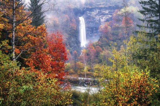 Waterfall in autumn-coloured Verzasca Valley, Canton Ticino, Switzerland