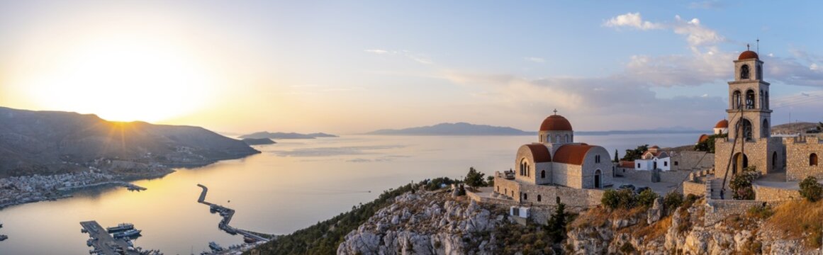 Sunrise, greek-orthodox monastery Saint Savvas, town view of Kalymnos, harbour and sea, Kalymnos, Dodecanese, Greece