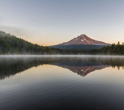 Sunrise, reflection of the volcano Mt. Hood in Lake Trillium Lake, Oregon, USA
