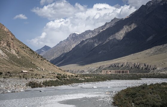 Abandoned buildings in a barren landscape, ghost town of Enilchek in the Tien Shan Mountains, Ak-Su, Kyrgyzstan