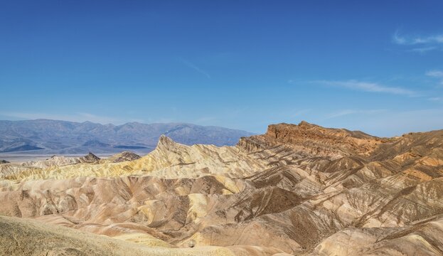 Manly Beacon rock, Badlands, Zabriskie Point,  Panamint Range behind, Death Valley National Park, California, USA