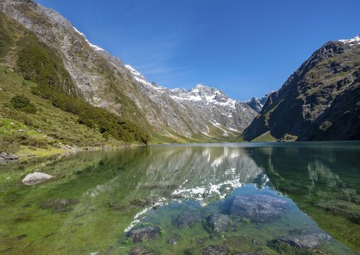 Reflection in Lake Marian, Fiordland National Park, Te Anau, Southland, South Island, New Zealand