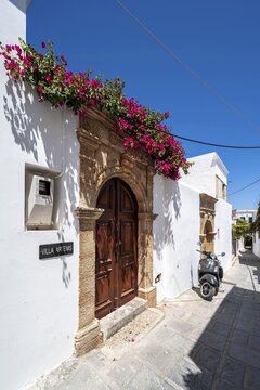 House entrance with bougainvillea on a white house, Lindos alleys, Lindos, Rhodes, Doedekanes, Greece