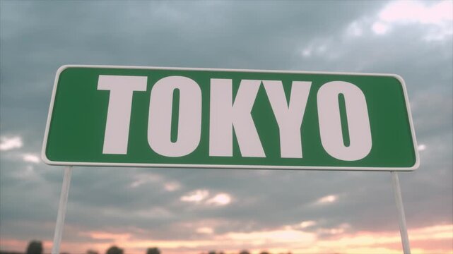 Green Tokyo Road Sign Against Dramatic Cloudy Sunset Sky