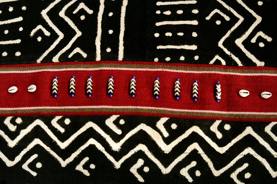 Black red and white textile pattern with beaded detail