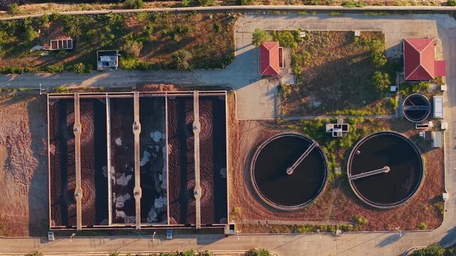 Aerial view of industrial wastewater treatment plant clarifiers and sedimentation tanks.