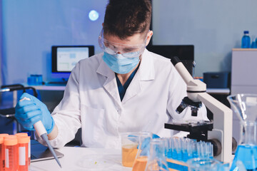 Fototapeta premium Lab technician experimenting in lab