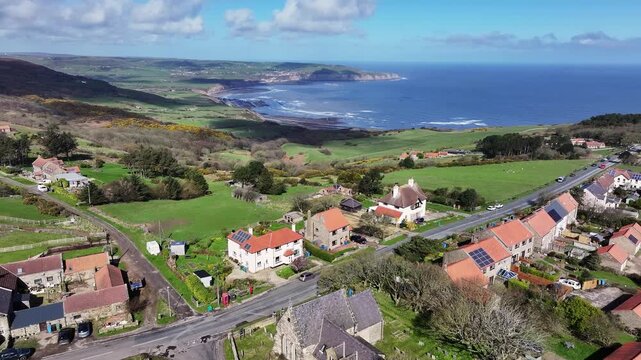 Aerial video Ravenscar UK. Ravenscar is a coastal village in the county of North Yorkshire, England. It is within the civil parish of Staintondale and the North York Moors National Park.