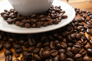 Fototapeta premium Beautiful dark background with fresh roasted and quality coffee beans steaming with rich aroma