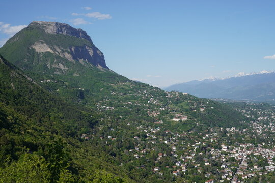 View from La Bastille, Grenoble, France, showcasing the Chartreuse Mountains with Mount Saint-Eynard prominently in view.