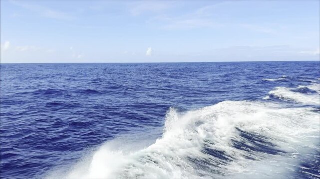 open ocean, fare off shore. breaker wave overturn and  roll opposite the swell, make white foam, spray and drops. nonstop video. background. 