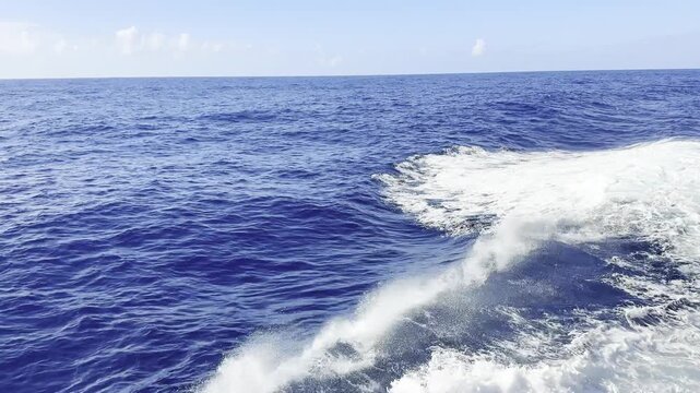 vessel proceeding at open ocean. white bow wave came opposite the swell, overturn. make foam and drops. nonstop video. background. 