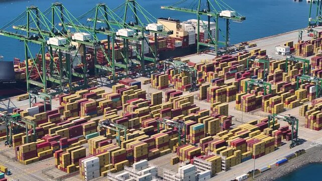 Global supply chain issues impact container logistics and cargo delivery at port facilities amid shipping congestion