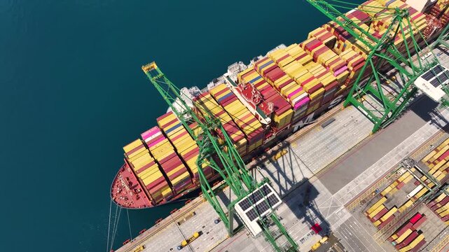 Operations at a busy port focusing on container loading and shipping logistics in international trade