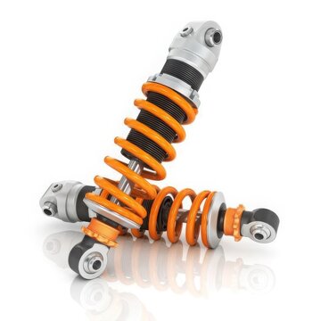 Orange car suspension coilovers on white background