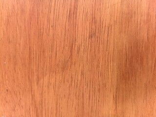 Naklejka premium Warm wood grain texture with subtle natural patterns. Rich tones evoke earthy, organic comfort. Ideal for interiors, design, or rustic branding projects. Smooth finish highlights natural beauty