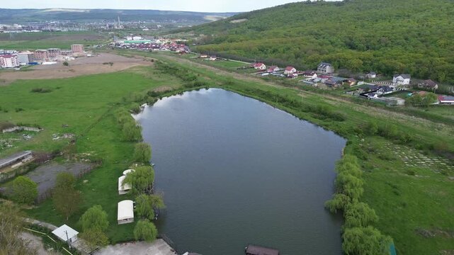 Aerial view of a scenic lake near Vaslui city, Romania. Beautiful countryside natural landscape.
