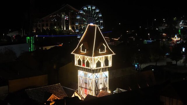 Night View Of Capivari Village In Campos Do Jordao In Sao Paulo Brazil. Illuminated Ferris Wheel. Downtown Cityscape. European Architecture. Capivari Village In Campos Do Jordao In Sao Paulo Brazil. 