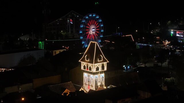 Night View Of Capivari Village In Campos Do Jordao In Sao Paulo Brazil. Illuminated Ferris Wheel. Downtown Cityscape. European Architecture. Capivari Village In Campos Do Jordao In Sao Paulo Brazil. 