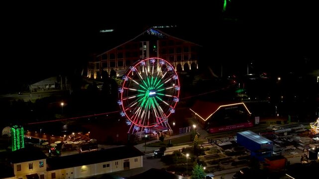 Night View Of Capivari Village In Campos Do Jordao In Sao Paulo Brazil. Illuminated Ferris Wheel. Downtown Cityscape. European Architecture. Capivari Village In Campos Do Jordao In Sao Paulo Brazil. 