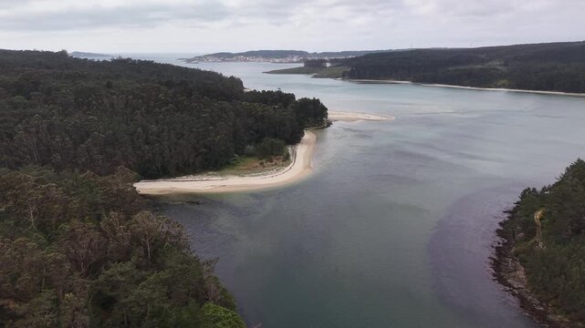 Furna do sapo viewpoint overlooking a winding river estuary surrounded by green forests under an overcast sky