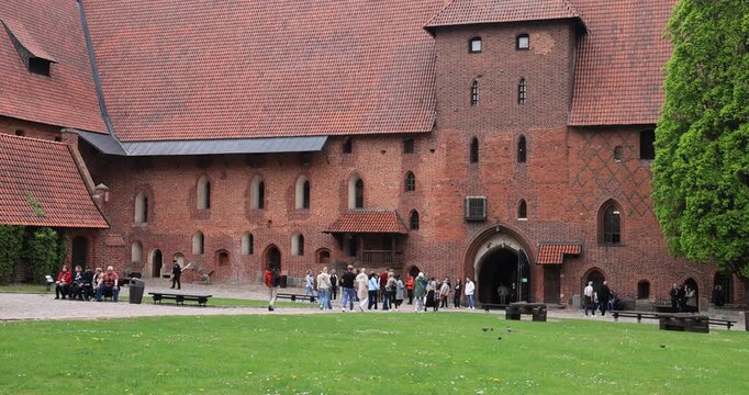Poland Malbork Castle tourism coutyard tilt. Medieval castle of the Teutonic Order. 13th century, Largest castle in the world by land area, 52 acres. Historical buildings. Educational displays.