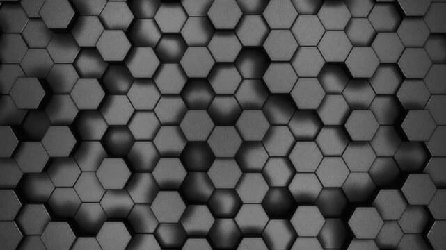 Rough grainy honeycomb background of patterned hexagons. Random array of 3d rendered hex shapes creating coarse, dark, shadowy pattern of grain and noise textured backgrounds. Loop.