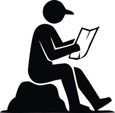 Hiker sitting on a rock reading a map