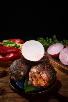 Fresh Guangxi Lipu Taro Root with Vegetables on Wooden Board - Traditional Chinese Ingredients