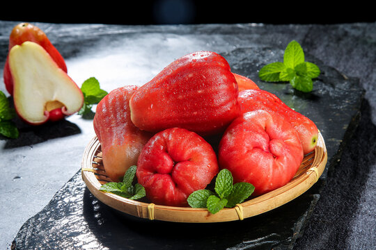 Fresh Red Wax Apples Rose Apples in Bamboo Basket with Mint Hainan Tropical Fruit