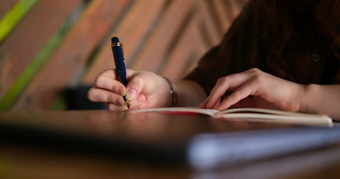 cinematic close-up hands carefully writing in a notebook with an elegant fountain pen. Day In The Life Series. beauty of handwriting, creativity, and thoughtful concentration through detailed movement