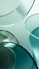 Close-up of translucent blue-green curved shapes with abstract, translucent