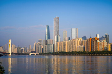 Guangzhou Pearl River skyline with modern skyscrapers and bridge at sunset © DoThi