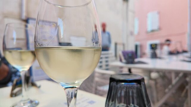 Close Up of French White Wine in a Glass at Outdoor Cafe