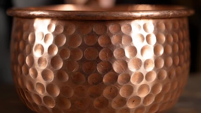 Close Up of Hammered Copper Pot with Intricate Texture.