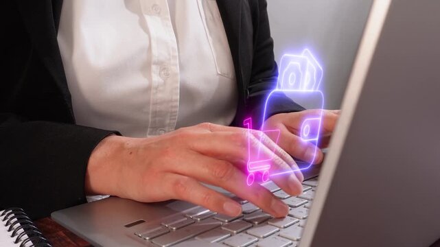 Wallet usage in commerce. A female executive's hands focused while working on her laptop with a virtual wallet icon and shopping cart.