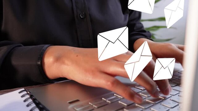 Close-up shot of a businesswoman working on her computer with an animation of several mail envelopes being lifted. Arrival of several emails.