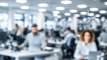Fototapeta premium Blurred Modern Office Interior with Diverse Employees Working at Desks