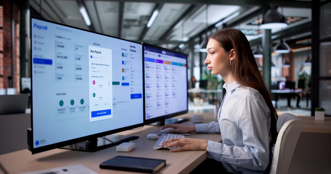 Woman Uses HR Software On Computer