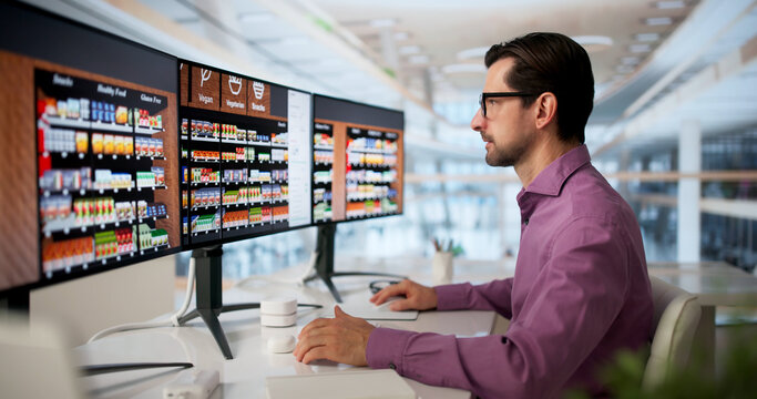 Retail Manager Uses Computer