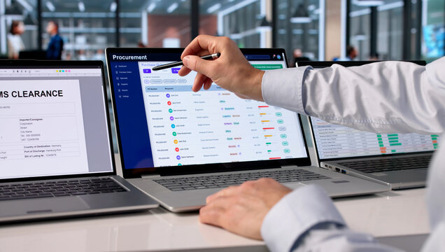 Mature Procurement Manager Analyzes Supplier Contracts