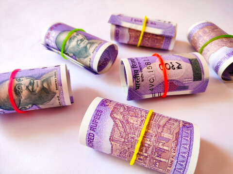 Top View of Rolled Indian Hundred Rupee Banknotes
