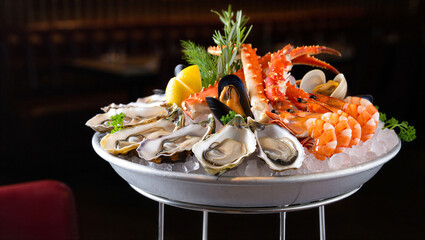 Luxurious fresh seafood platter on ice with lobster prawns oysters and mussels © islamamar