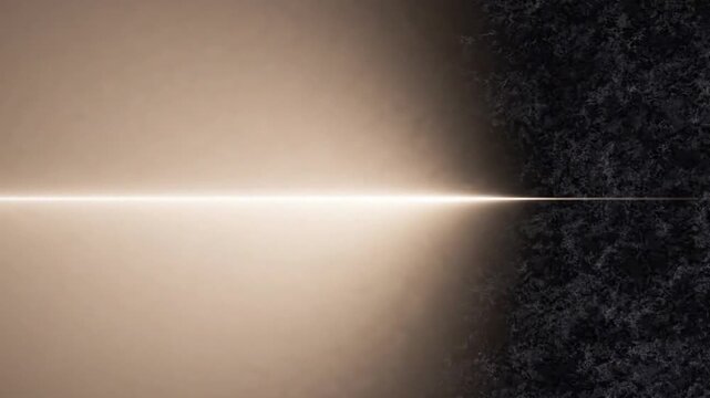 Abstract glowing light beam dividing dark textured space with soft golden gradient on one side