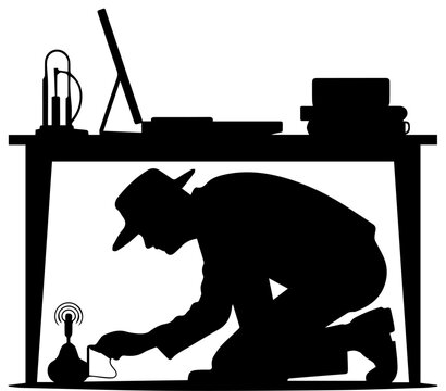 Black Silhouette of a Spy or Secret Agent Planting a Listening Bug Under an Office Desk