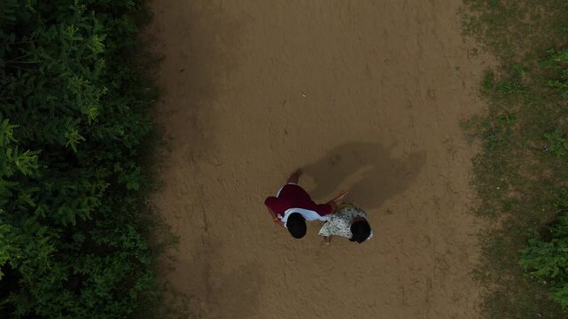 Aerial view of devotees walking on the sacred Govardhan Parvat Parikrama Marg surrounded by lush greenery, Mathura.